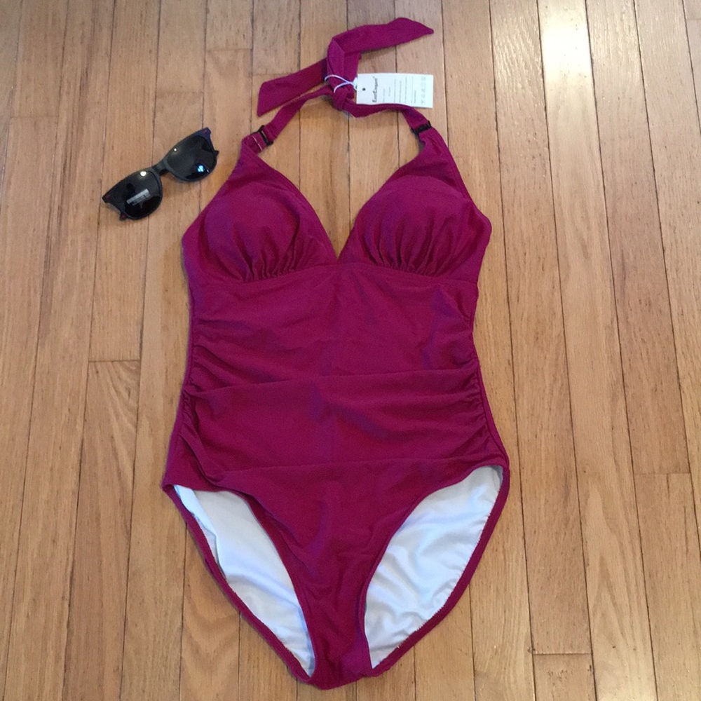 East Elegant one piece swimsuit. Size medium, color mauve. New with tags.